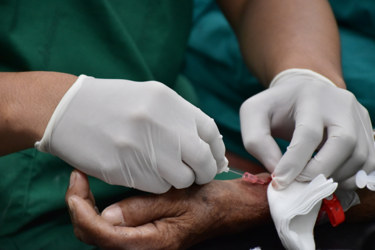Radiologist Performing An Image Guided Pain Relief Injection At A Clinic In Albury
