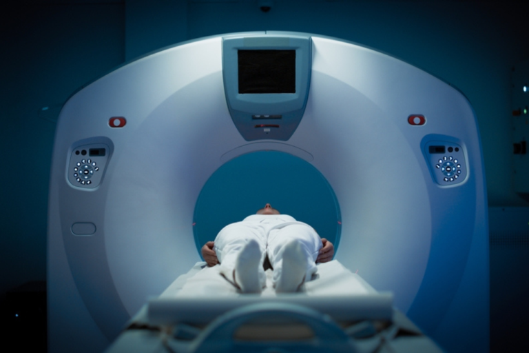 A Medical Professional Performing A Ct Calcium Score Scan On A Patient